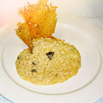 Risotto con zucca, lardo, capesante, Grana Padano DOP e tartufo nero