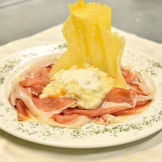 Risotto con melone di Sermide, spuma di Grana Padano e crudo di Montagnana